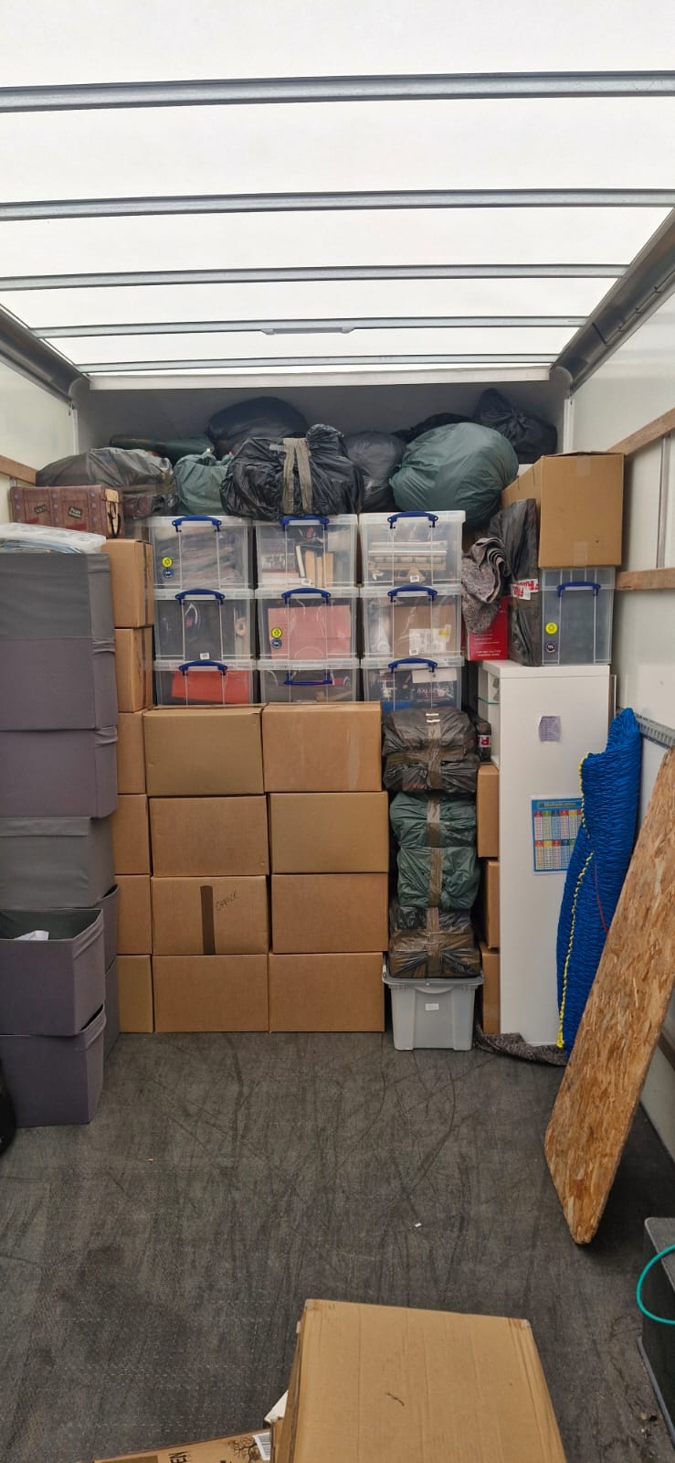 Luton loaded with storage and cardboard boxes, packed tightly