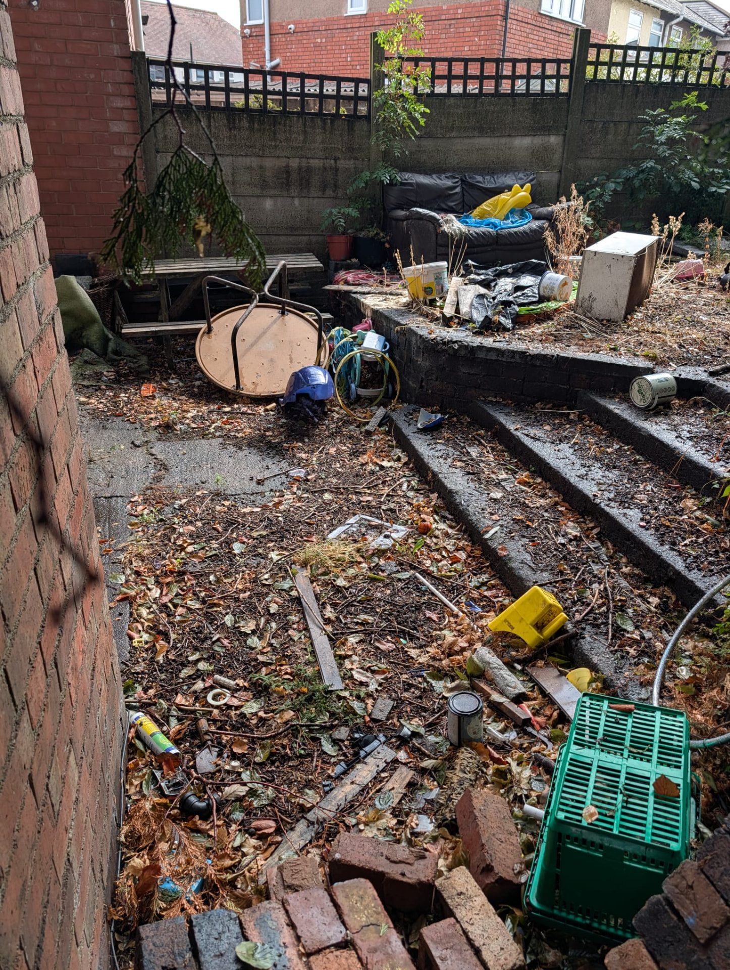 Before: garden steps and patio covered in rubbish