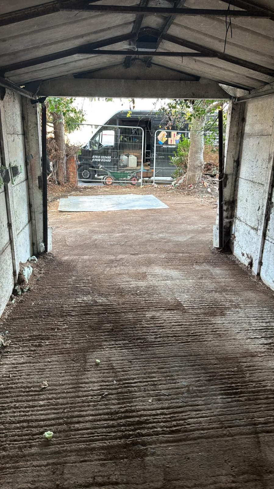 After: garage emptied and swept, with the Shaw Haul van outside