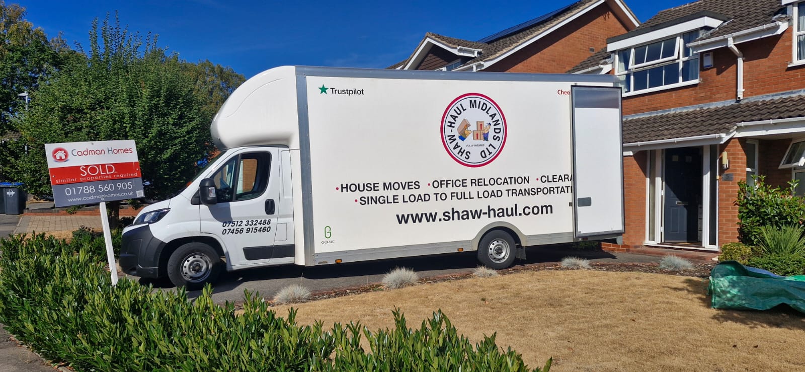 Shaw Haul Luton van outside a family home with a Sold sign