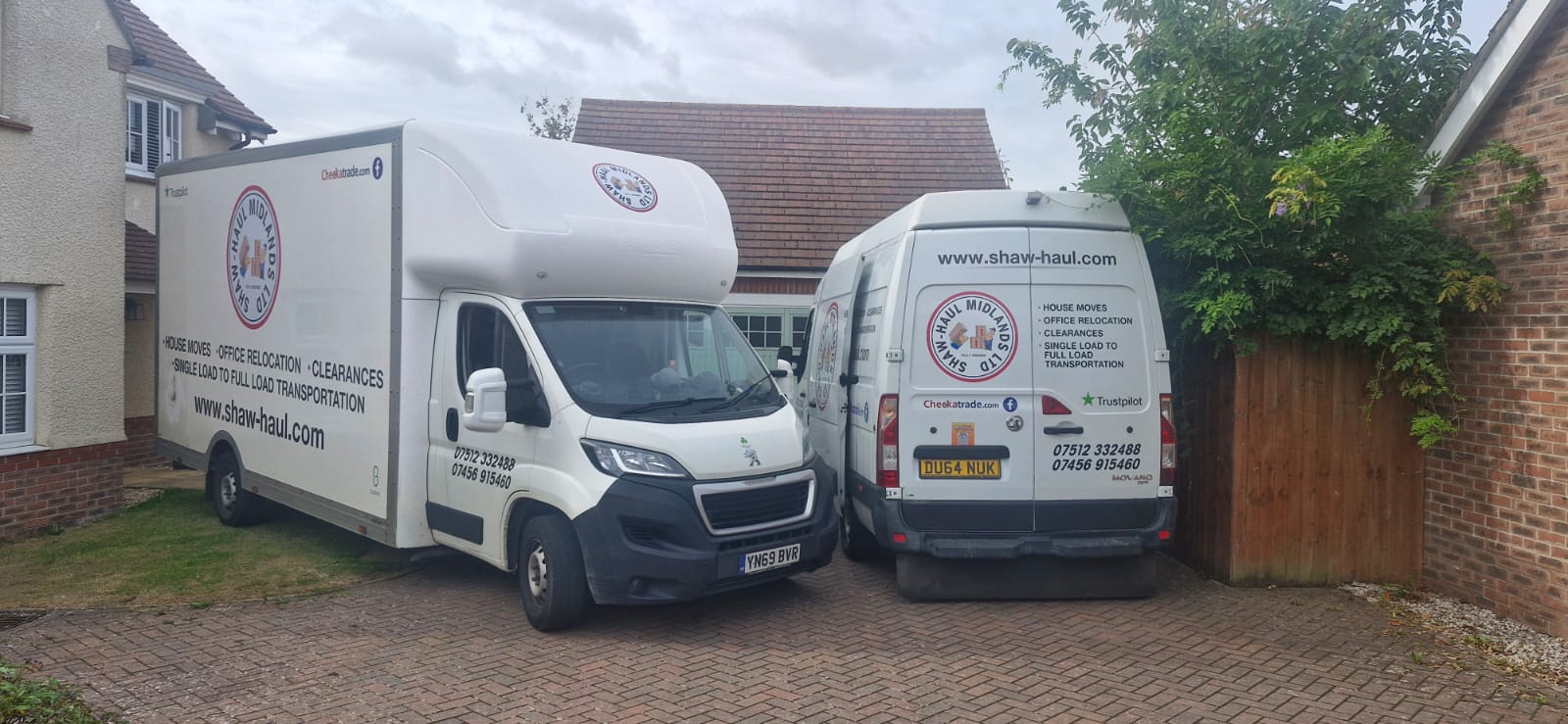 Shaw Haul Luton and panel van parked together on a block-paved driveway