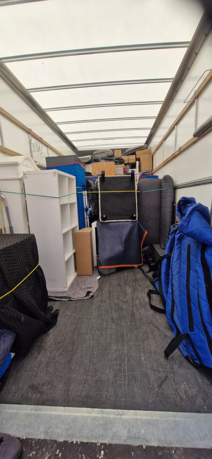 Fully loaded Luton with blanket-wrapped furniture strapped in place