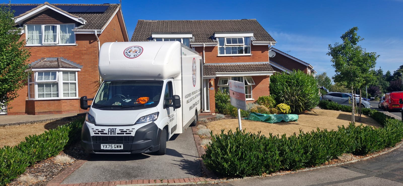 Shaw Haul Luton on the driveway of a sold family home