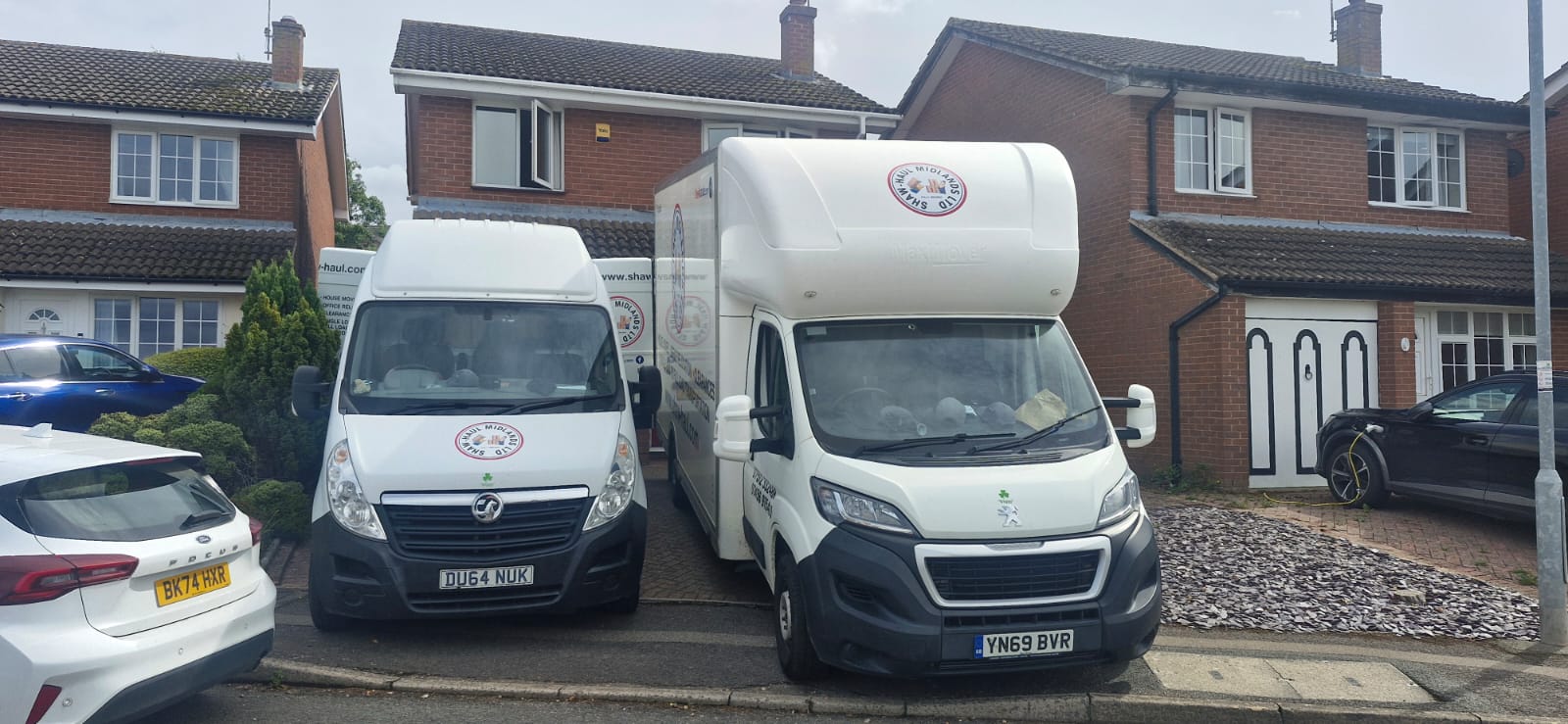Shaw Haul Luton and panel van side by side on a driveway