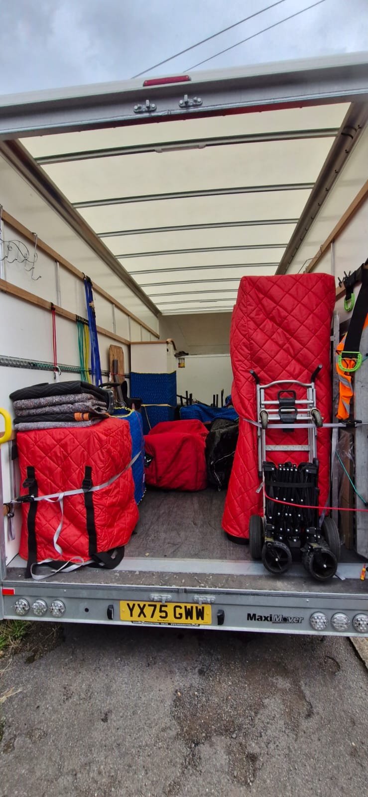 Inside a Luton: furniture wrapped in padded covers and strapped in